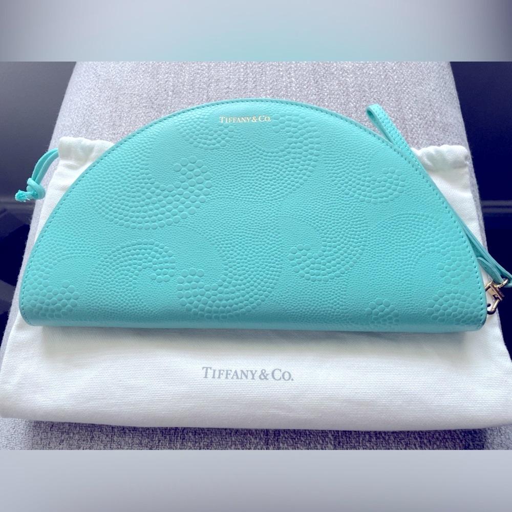 Tiffany Co. Authentic Half Moon embossed Leather Clutch.